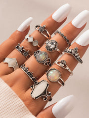 silver ring set with flowers, stones, heart